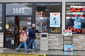 Customers walk out the door